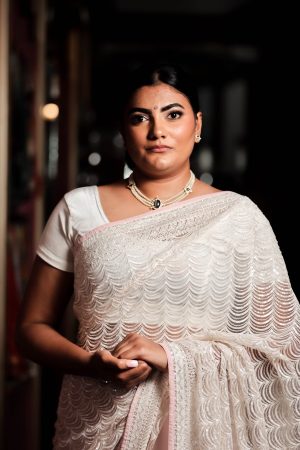 Cream & pinky sequinned net saree