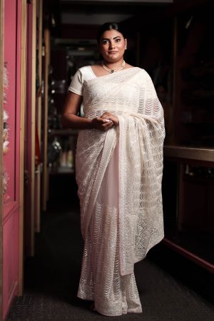 Cream & pinky sequinned net saree