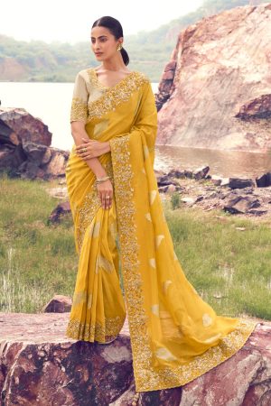 Deep yellow silky embroidered saree